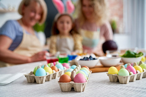 Close up of family coloring Easter eggs at home