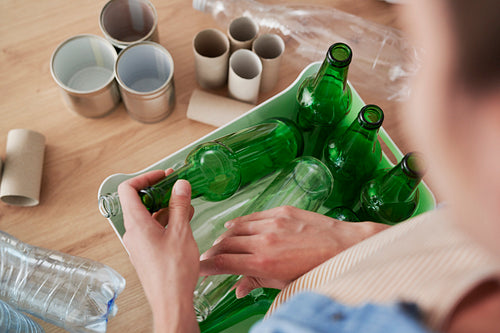 High angle view of glass bottles in the bin