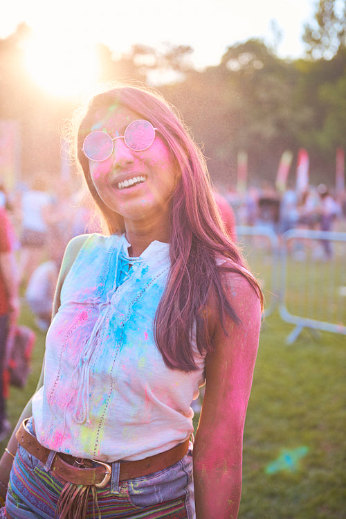 Beautiful African woman in holi colors at the party