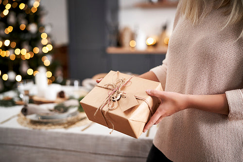 Close up woman holding Christmas present