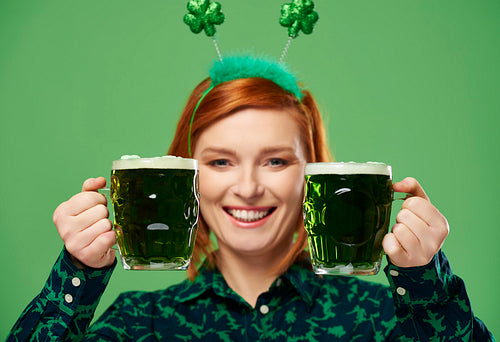 Woman making a toast to Saint Patrick's Day